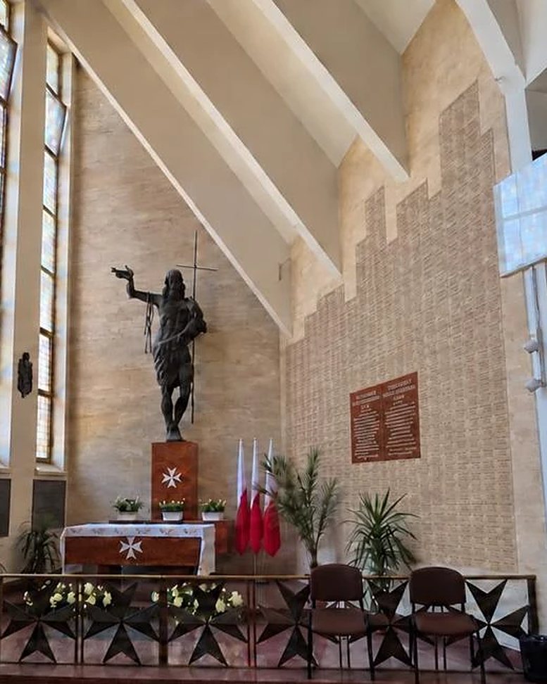 Visualization of the finished Wall of Remembrance: the wall beside the altar covered with engraved marble stones.