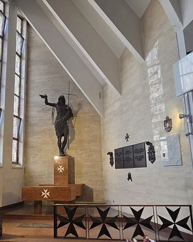 The wall beside the altar today, before the Wall of Remembrance is set in it.